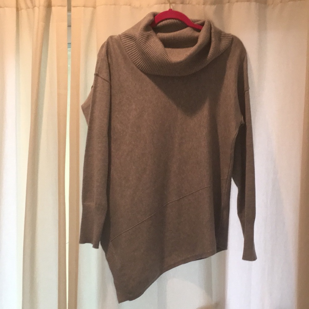 Asymmetric cowl neck gray sweater.
